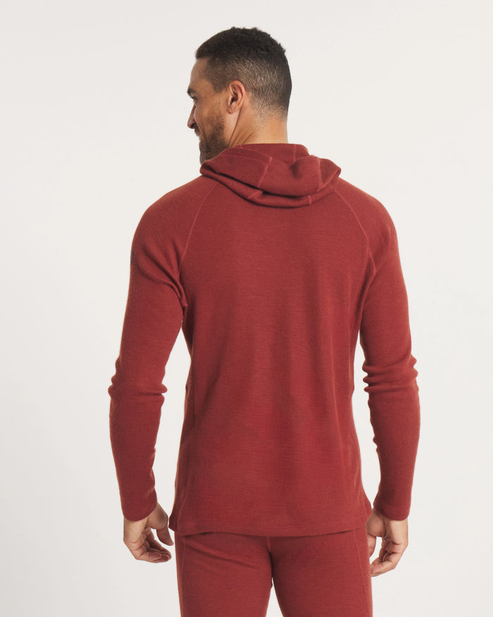 Back view of Men’s Thermal Hoodie in Clay on model showing slim fit, raglan sleeves and hood against an off-white background