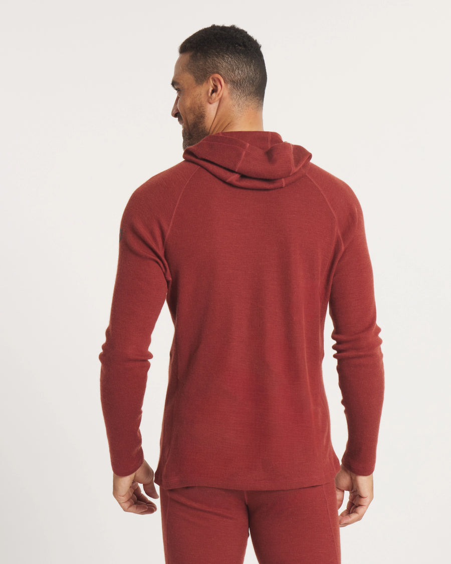 Back view of Men’s Thermal Hoodie in Clay on model showing slim fit, raglan sleeves and hood against an off-white background