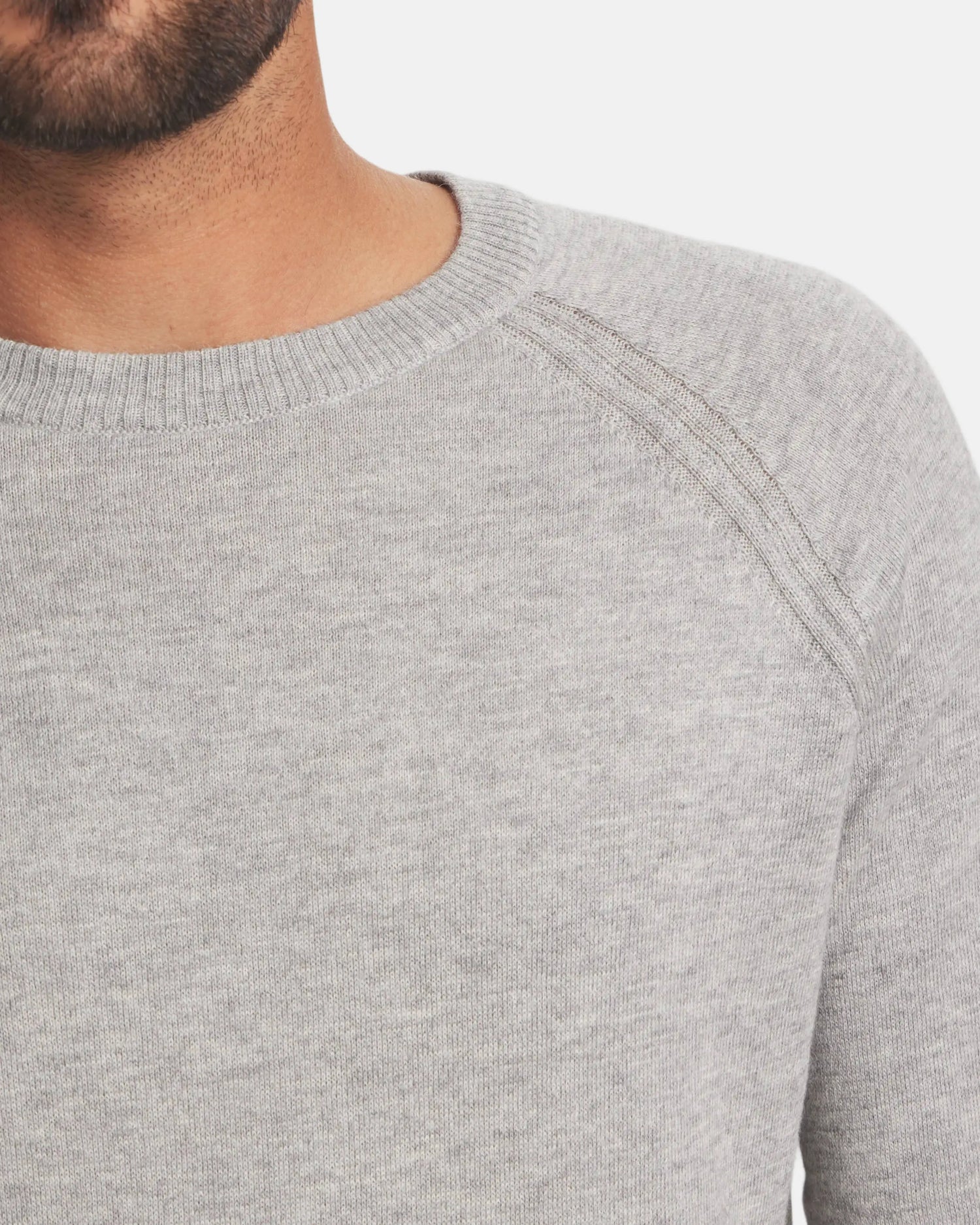 Front close-up of Men’s Ultralight Crew in ice heather grey worn by model, showing crew neck and raglan shoulder seam