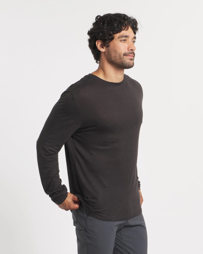 Three-quarter view of Men’s Aire alpaca long sleeve shirt showing lightweight breathable fabric and fitted hem on white background