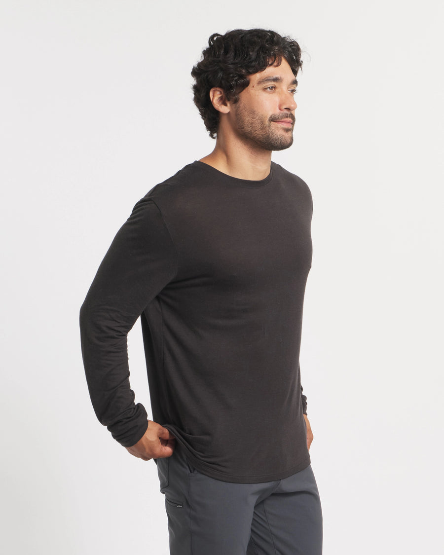 Three-quarter view of Men’s Aire alpaca long sleeve shirt showing lightweight breathable fabric and fitted hem on white background