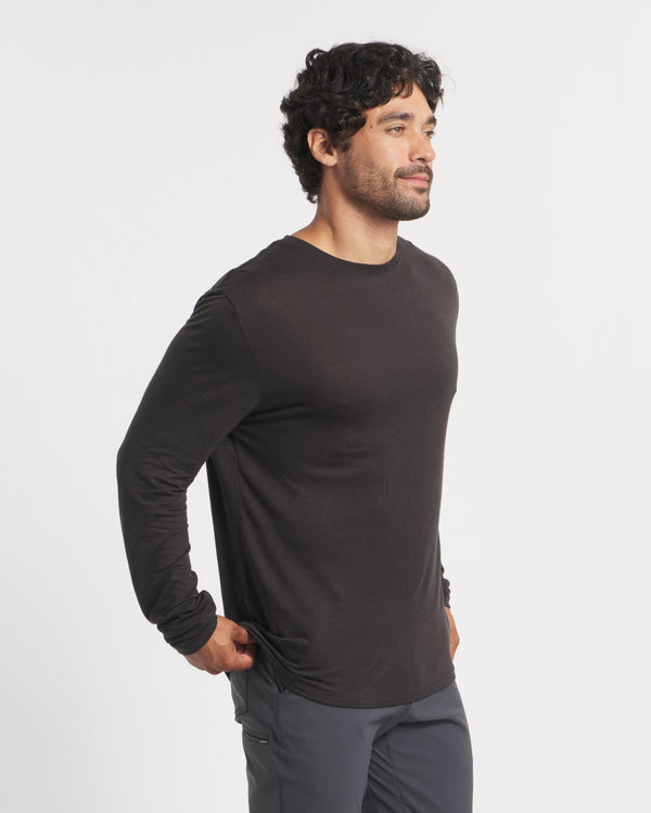Three-quarter view of Men’s Aire alpaca long sleeve shirt showing lightweight breathable fabric and fitted hem on white background