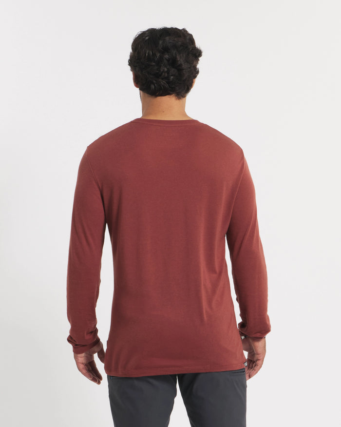 Back view of Men’s Aire long sleeve alpaca shirt showing clay red color and regular fit on model against white background