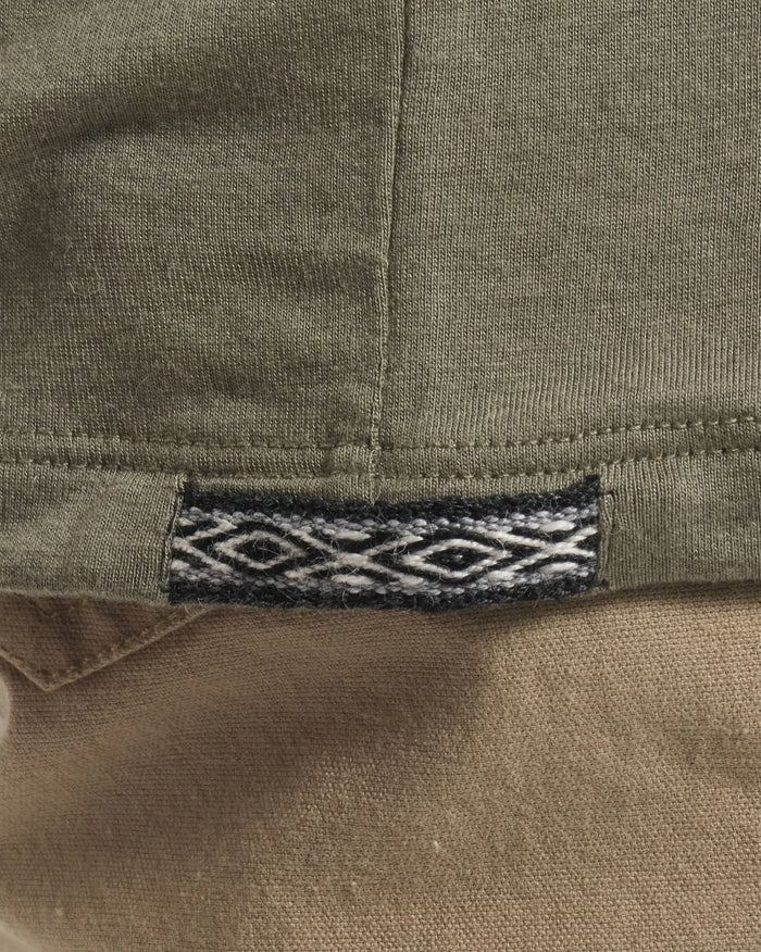 Close-Up of Inca ID on Men's Aire Long Sleeve Shirt in Eucalyptus / Green – PAKA Apparel