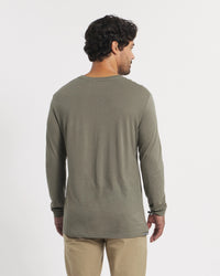 Back view of Men’s Aire Long Sleeve shirt showcasing lightweight alpaca fabric and relaxed fit on plain white background