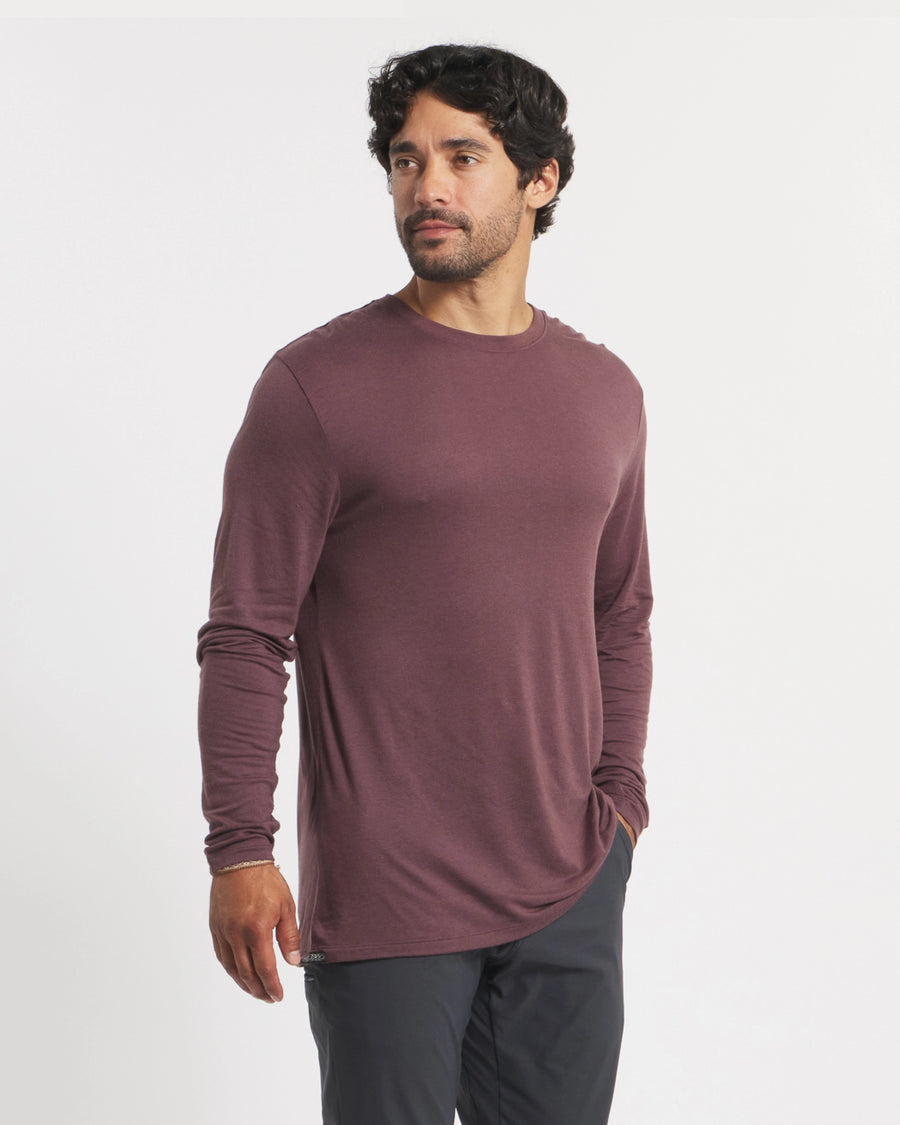 Three-quarter front view of Men’s Aire long sleeve shirt in Fig on model showcasing soft, lightweight alpaca fabric with plain white background