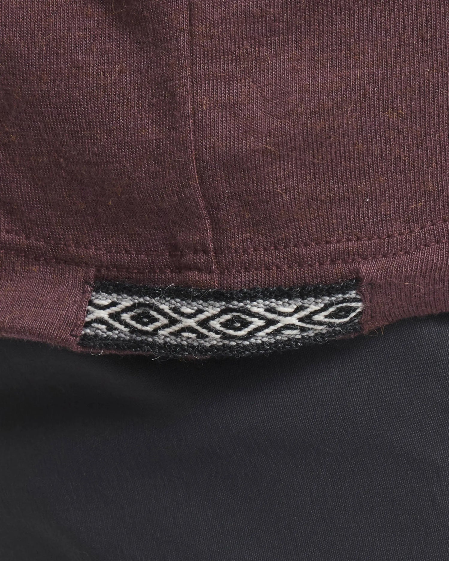 Close-Up of Inca ID on Men's Aire Long Sleeve Hiking Shirt in Fig / Purple – PAKA Apparel