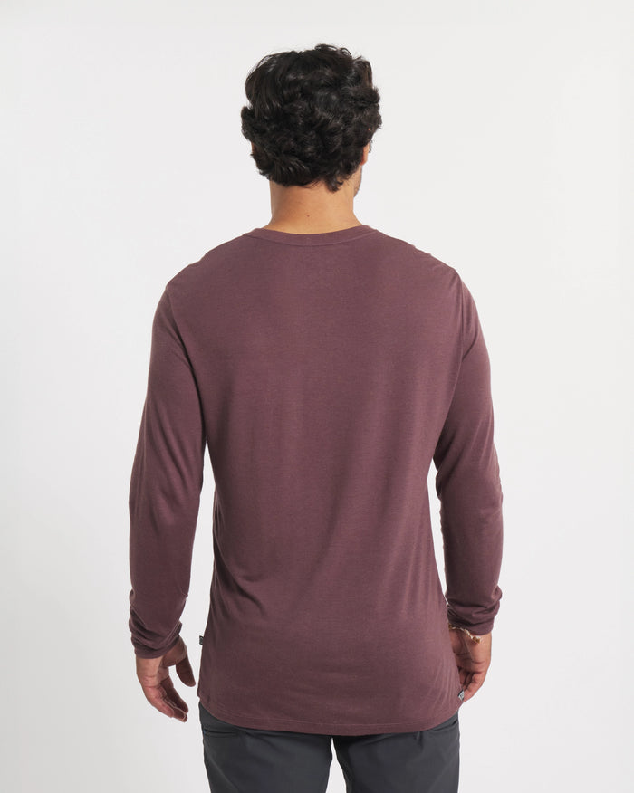 Rear view of Men’s Aire Long Sleeve shirt in fig showing long sleeves and slim fit on a model against a white background