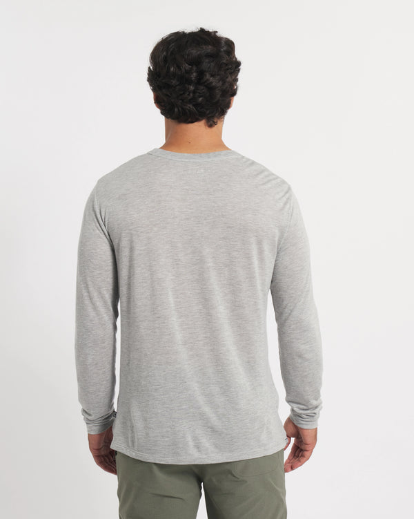 Back view of Men’s Aire Long Sleeve showing heather grey lightweight alpaca-blend fabric and regular fit on white background