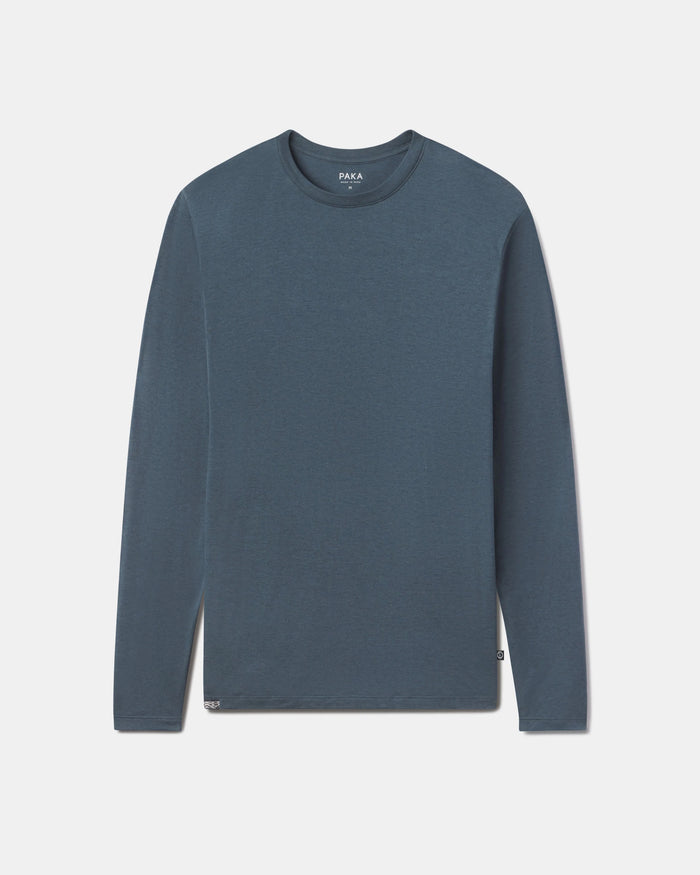 Front flat lay of Men’s Aire long sleeve shirt showing crew neck and soft alpaca fabric in navy on light gray background