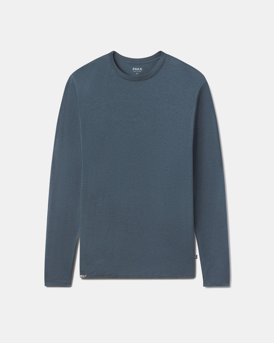 Front flat lay of Men’s Aire long sleeve shirt showing crew neck and soft alpaca fabric in navy on light gray background