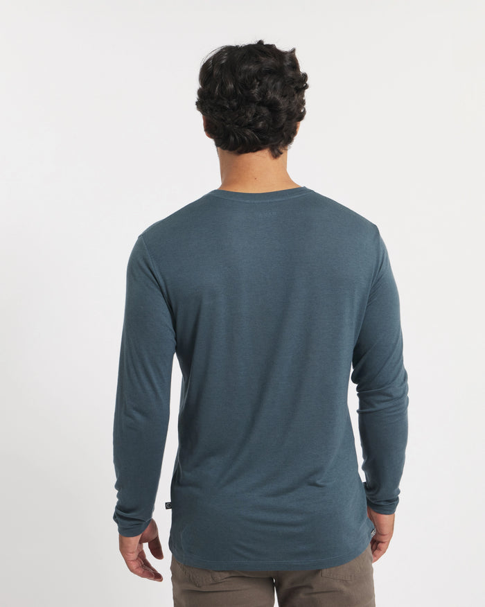 Back view of Men’s Aire Long Sleeve alpaca shirt showcasing lightweight knit and regular fit on model with white studio background