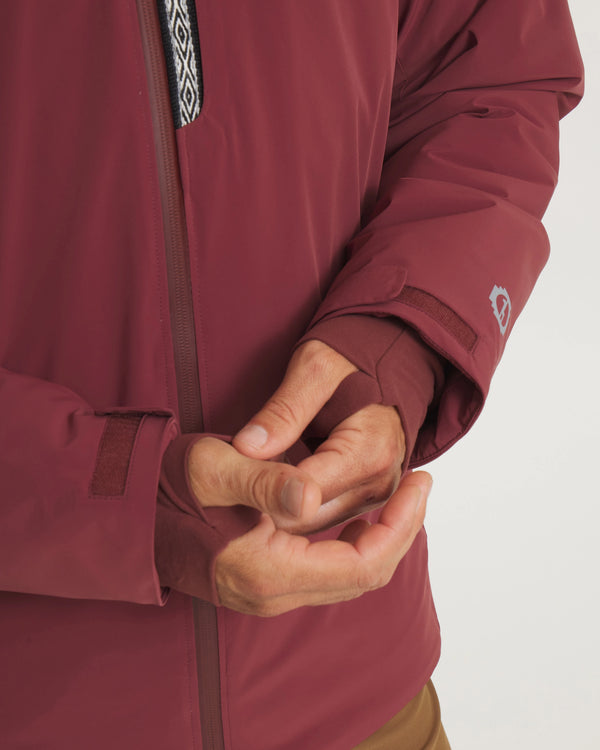 Close-Up of Hands Through Thumbholes of Burgundy Men’s Apu Parka Sustainable Ski Jacket – PAKA Apparel