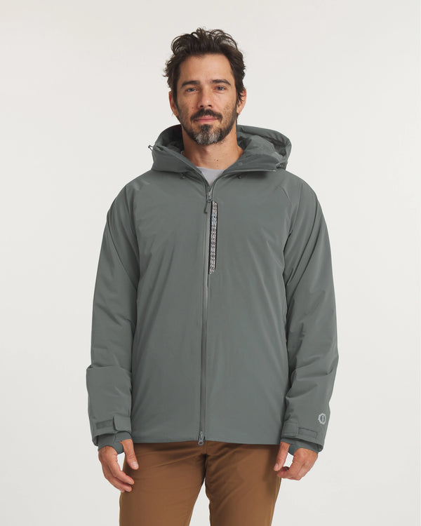 Model Wearing Men’s Apu Parka in Eucalyptus with Hood and Zipper Details on Display – PAKA Apparel