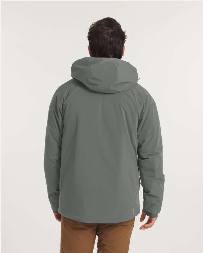 Rear view of Men’s Apu Parka in eucalyptus showing insulated hood and relaxed hip-length fit on light gray background