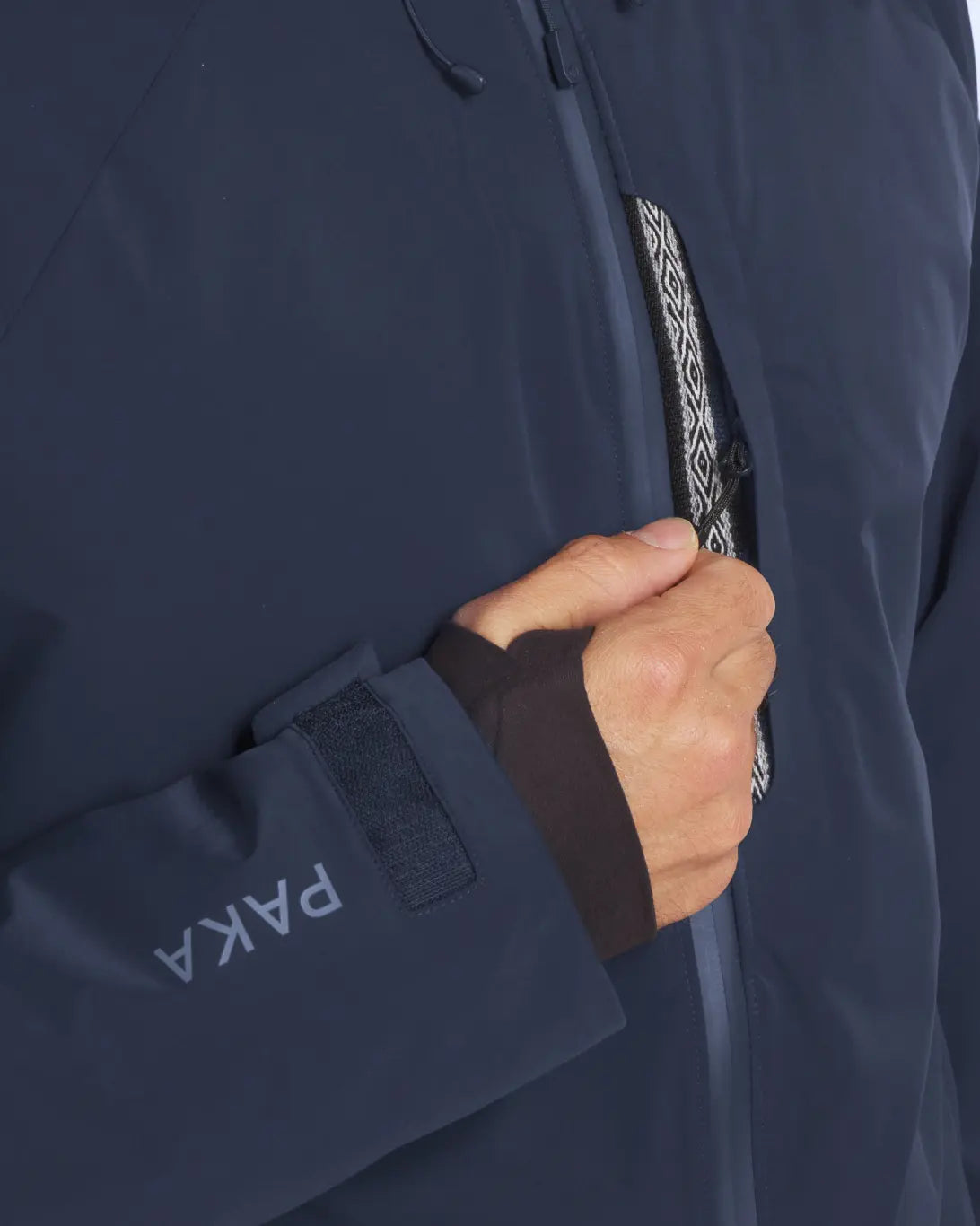 Closeup of Inca ID on Front Zip of Navy Men's Parka Winter Jacket with PAKAFILL® Alpaca Insulation from Peru – PAKA Apparel