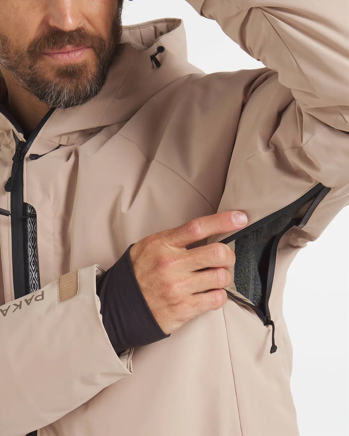 Man Pulling Arm Vent on Puma / Tan Apu Parka Winter Ski Jacket – PAKA Apparel