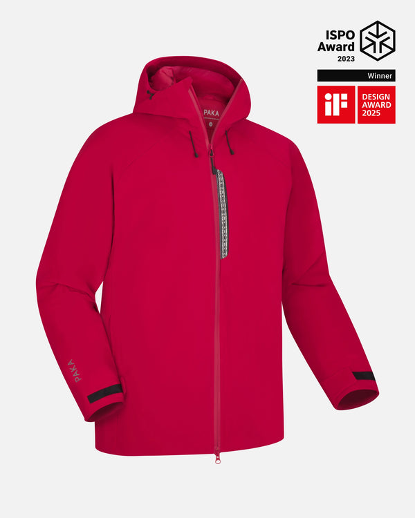 Front view of Men’s Apu Parka in red with hood, full-length zipper, chest zip pocket and PAKA logo on cuff on gray background