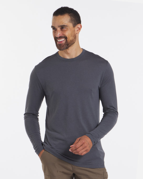 Smiling Model in Charcoal Blue Aire Men's Soft and Lightweight Long Sleeve Shirt – PAKA Apparel