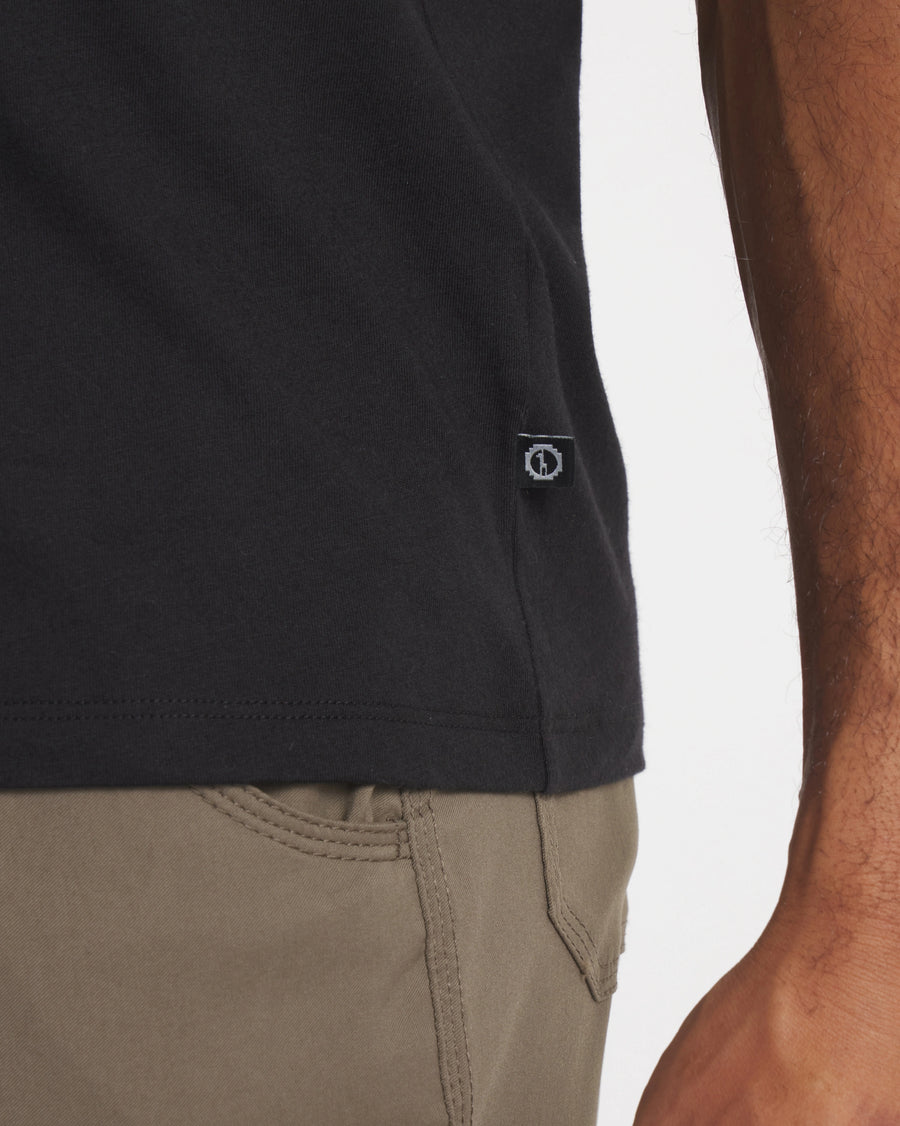 Side Waist View of PAKA Tag on Essential Tee Men's Lightweight Pima Cotton and Alpaca T-Shirt in Black – PAKA Apparel