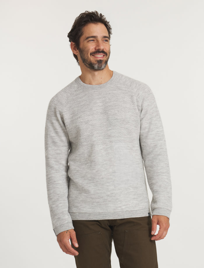Model Wearing Men's Mountain Crew Alpaca Outdoor Sweater in Heather Light Grey – PAKA Apparel