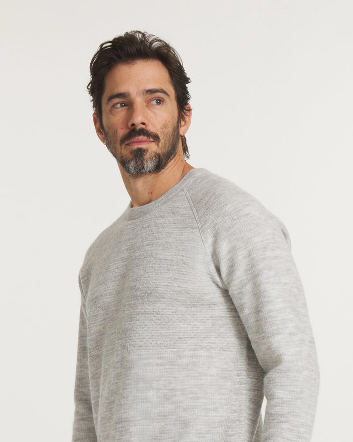 Model Wearing Men’s Mountain Crew Alpaca Outdoor Sweater in Heather Light Grey – PAKA Apparel