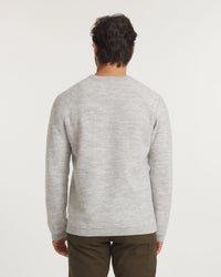 Back view of Men’s Mountain Crew sweater showcasing heather grey knit texture, raglan sleeves, and regular fit on a white background