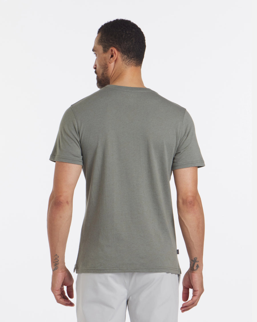 Rear view of Men’s Pocket Tee in alpaca and organic Pima cotton showing short sleeves and relaxed fit on model against white background
