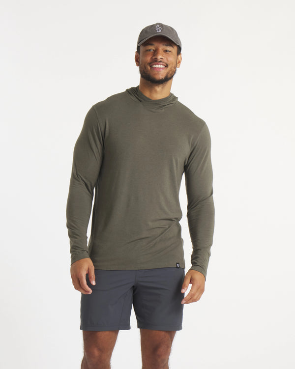 Model in Cap Wearing Andean Moss / Dark Green Ultralight Alpaca Sun Hoodie – PAKA Apparel