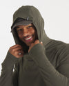 Close-Up of Model with Hood Up in Andean Moss / Dark Green Sol Men's Alpaca and Tencel Sun Hoodie – PAKA Apparel
