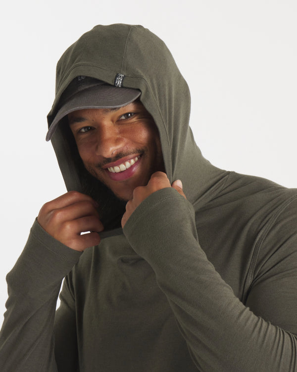Close-Up of Model with Hood Up in Andean Moss / Dark Green Sol Men's Alpaca and Tencel Sun Hoodie – PAKA Apparel