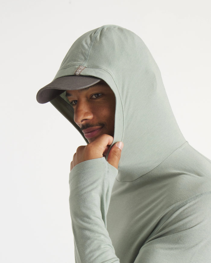 Close-Up of Hood Up on Model Wearing Sol Men's Alpaca Sun Protection Hoodie in Lichen / Light Green – PAKA Apparel