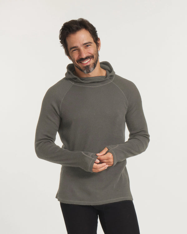 Three-quarter view of Men’s Thermal Hoodie in Andean Moss on model, slim fit with hood and thumbholes on white