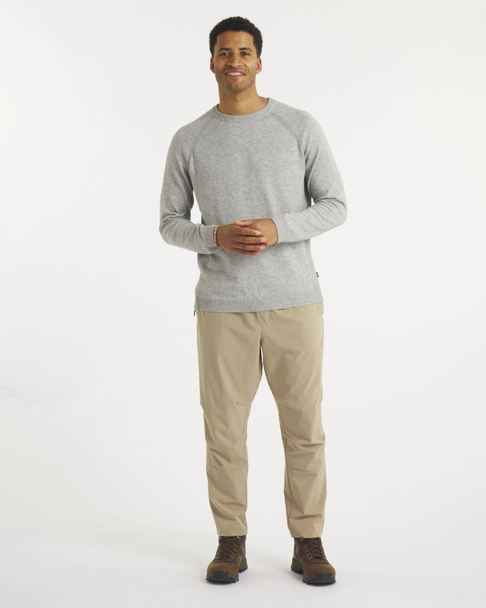 Front view of Men’s Ultralight 1.0 Crew alpaca sweater in heather grey, showing raglan sleeves and slim fit on model
