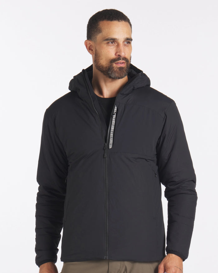 Front view of Men’s Apu puffer jacket in black with hood, full zip, and zippered hand pockets on white background