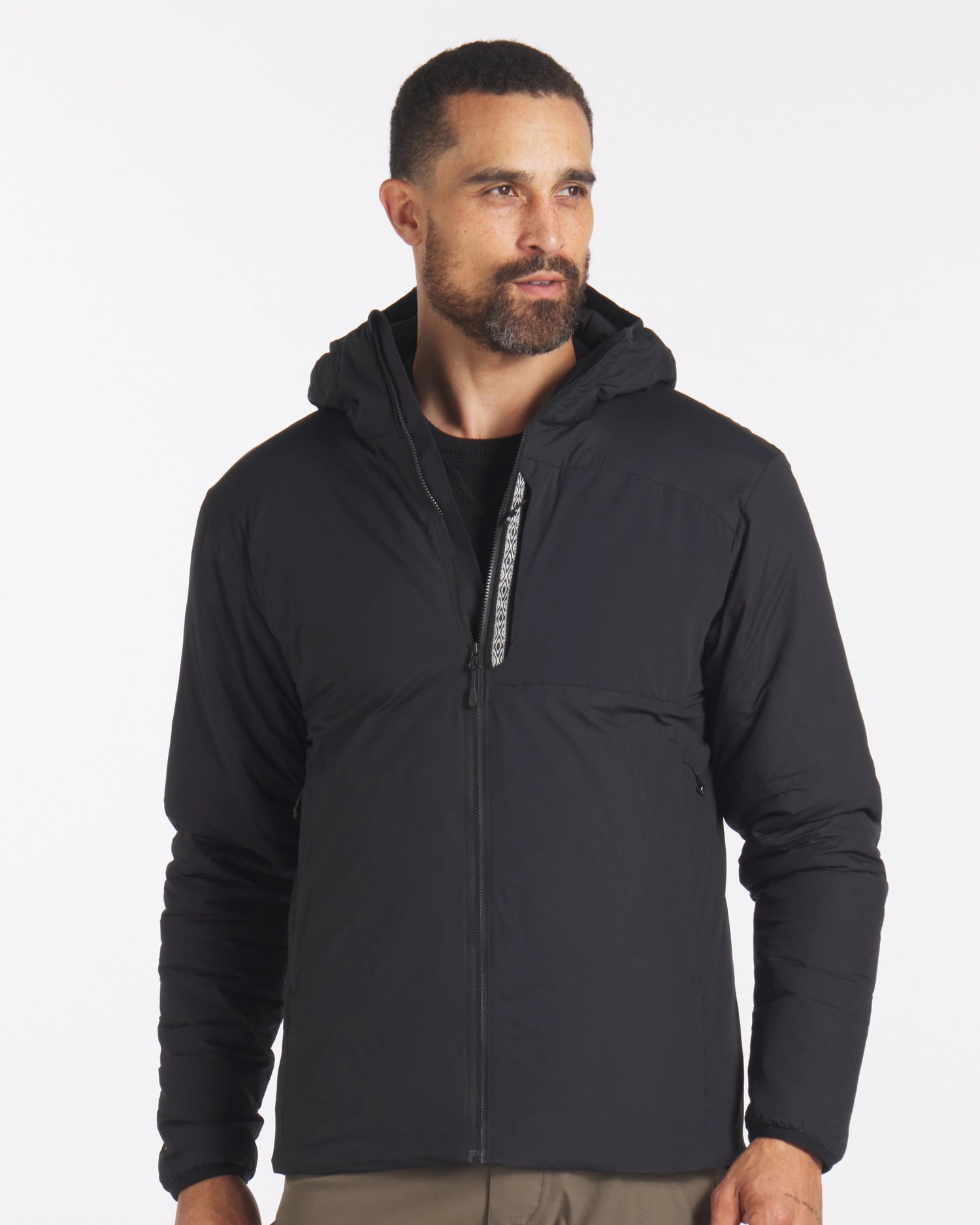 Front view of Men’s Apu puffer jacket in black with hood, full zip, and zippered hand pockets on white background