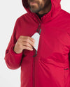 Man Placing Phone in Chest Pocket of Men's Apu Lightweight Puffer Jacket in Maca Red – PAKA Apparel