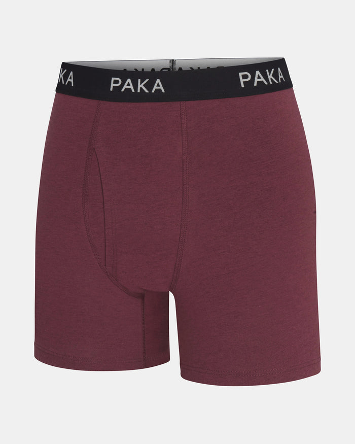 Front view of men’s Essential Boxer Brief in raisin with black PAKA branded waistband and contoured front pouch on light gray background