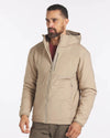 Model Wearing Sahara Tan Men's Apu Lightweight Puffer Jacket with a Hood –PAKA Apparel