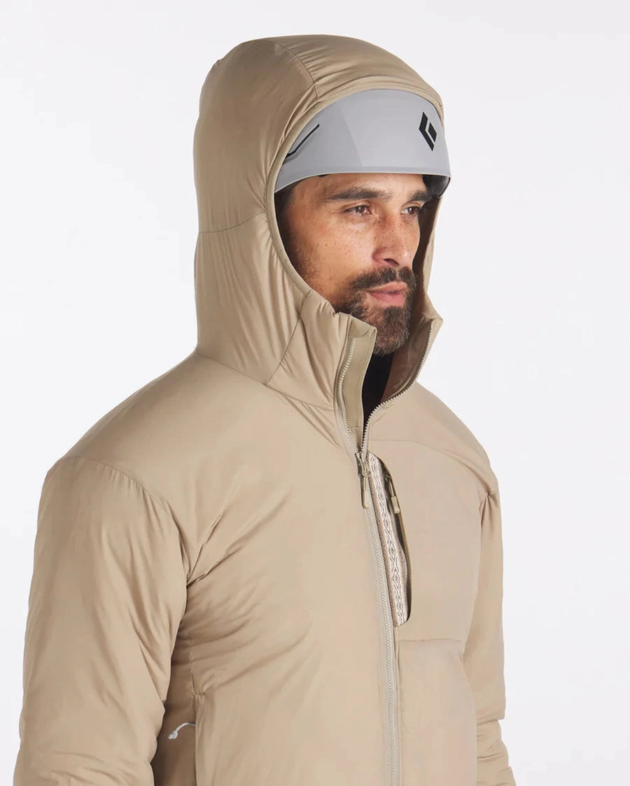 Side view of Men’s Apu Lightweight Puffer jacket (Desert) showing hood up and chest zip pocket on white background