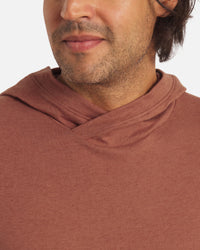 Close-up of Men’s Sol Hoodie in cinnamon showing crossover hood and soft alpaca-blend fabric on white background