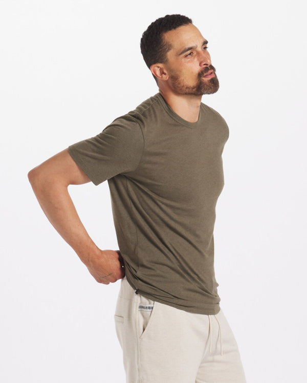 Model is 6'3" and wearing size Large. Side Shot of Model Wearing Andean Moss / Dark Green Men's Natural Alpaca T-Shirt – PAKA Apparel