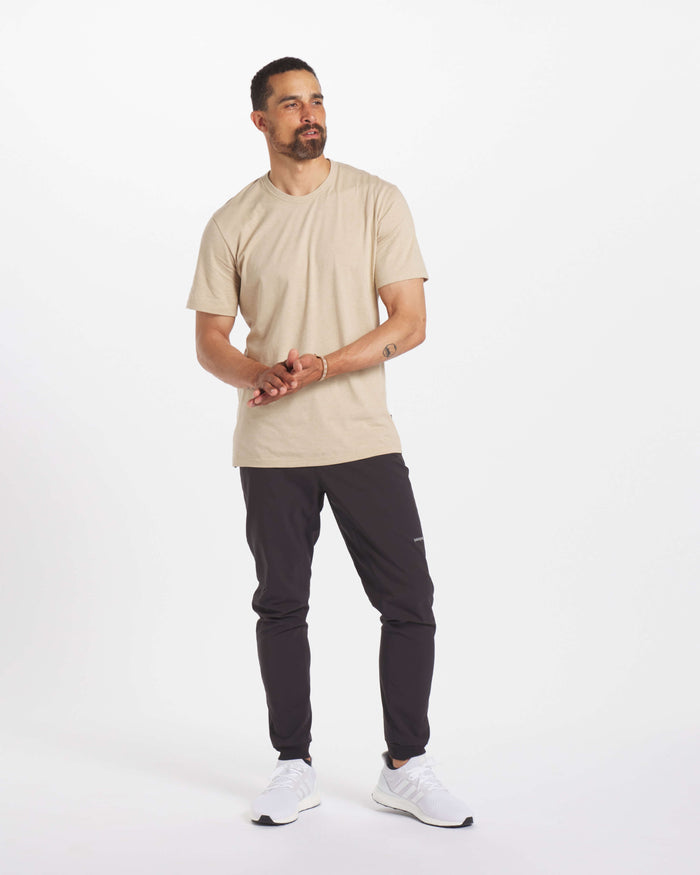 Model Looking Off Camera in Sand / Tan Organic Pima Cotton and Alpaca Blend  Men's T-Shirt – PAKA Apparel