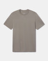 Front flat lay of Men’s Essential Tee in stone showing crew neck, short sleeves, and subtle branded hem tag on white background