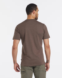 Back view of Men’s Tee in Wood on male model showing short sleeves and regular fit against a white background