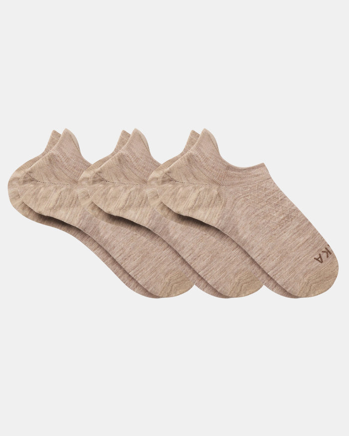 Top view of three beige Essential No Show Socks laid flat showcasing low-cut no-show design and marled knit on light gray background