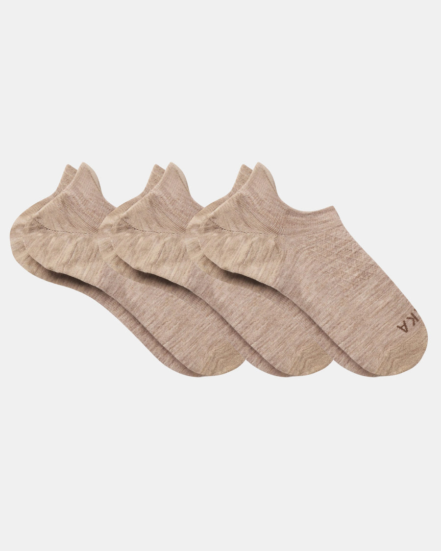 Top view of three beige Essential No Show Socks laid flat showcasing low-cut no-show design and marled knit on light gray background