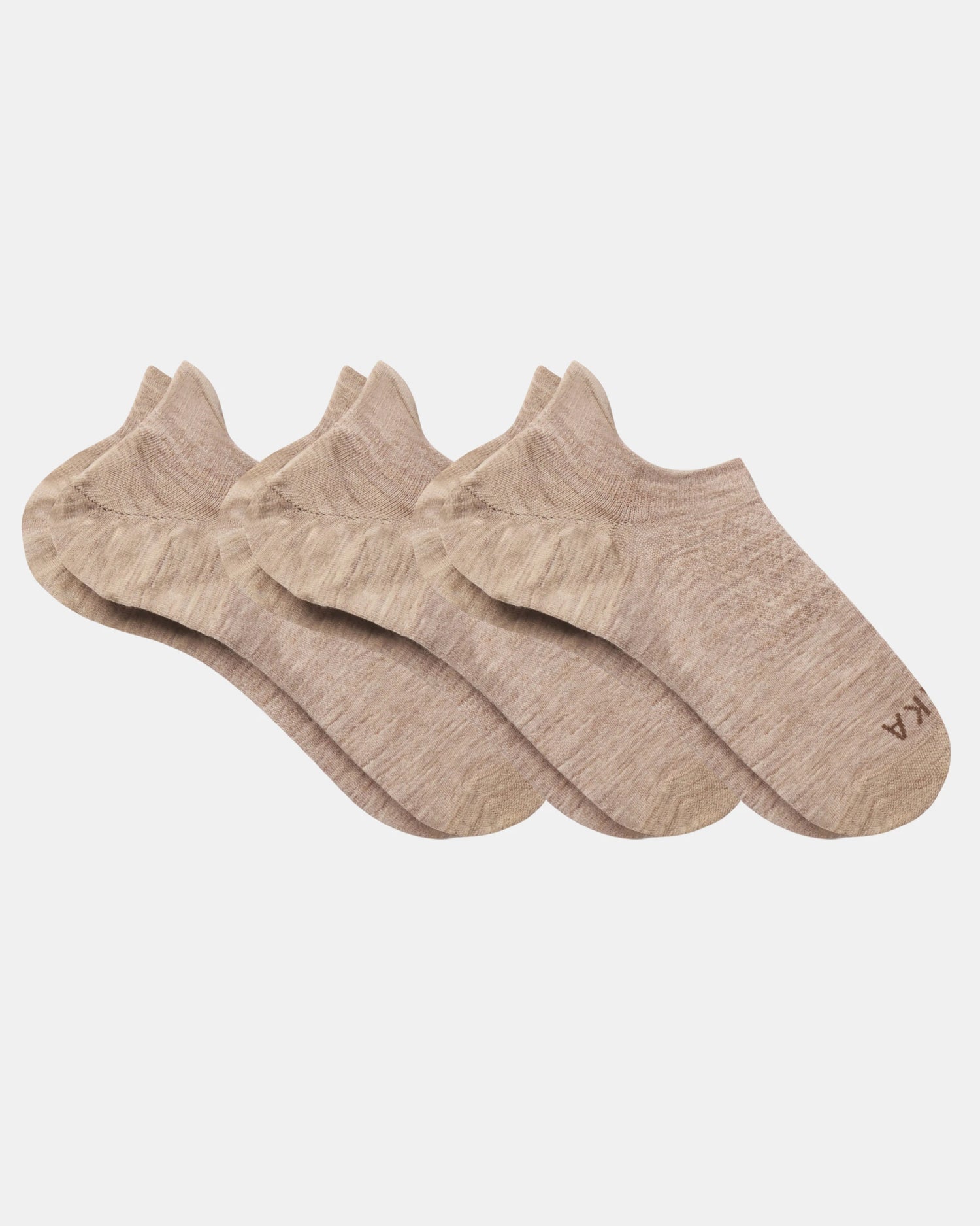 Top view of three beige Essential No Show Socks laid flat showcasing low-cut no-show design and marled knit on light gray background