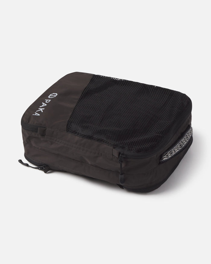 Black Travel Compression Packing Cube on Its Side with Hand Woven Inca ID and Mesh Pocket – PAKA Apparel