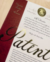PAKAFILL patent certificate with gold seal and red spine